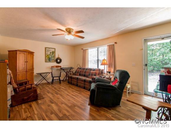 978 Cove Road Rutherfordton, NC 28139 - Photo 3 of 24 a living room with furniture and a flat screen tv
