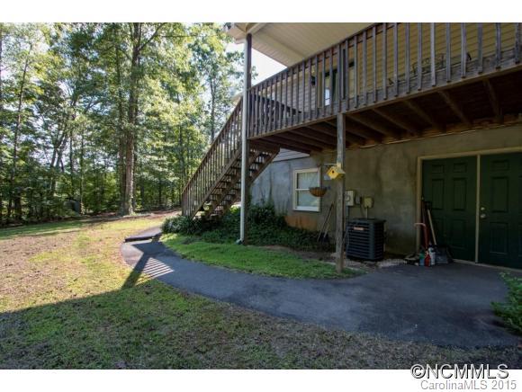978 Cove Road Rutherfordton, NC 28139 - Photo 22 of 24 a view of a chair and table in the backyard