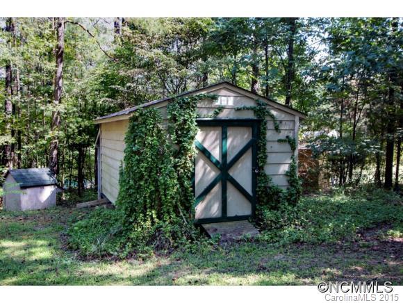 978 Cove Road Rutherfordton, NC 28139 - Photo 23 of 24 a view of a wooden door and a bench in a garden