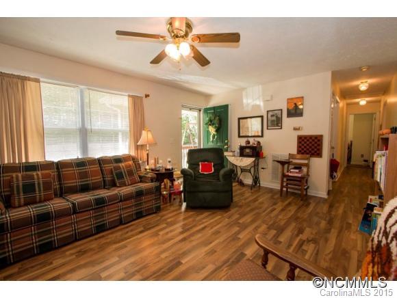 978 Cove Road Rutherfordton, NC 28139 - Photo 4 of 24 a living room with furniture and a flat screen tv