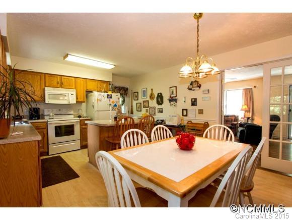 978 Cove Road Rutherfordton, NC 28139 - Photo 6 of 24 a kitchen with stainless steel appliances kitchen island granite countertop a table and chairs
