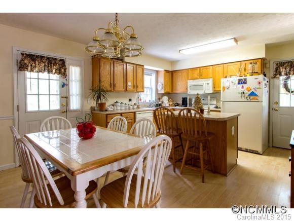978 Cove Road Rutherfordton, NC 28139 - Photo 7 of 24 a view of a dining room with furniture and chandelier