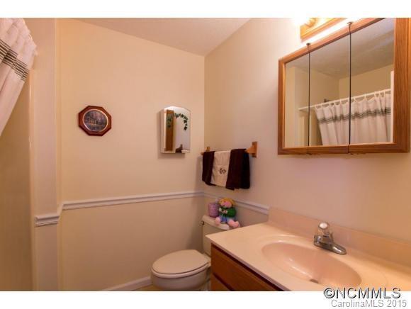 978 Cove Road Rutherfordton, NC 28139 - Photo 10 of 24 a bathroom with a sink mirror vanity and toilet