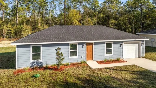 a house with trees in the background