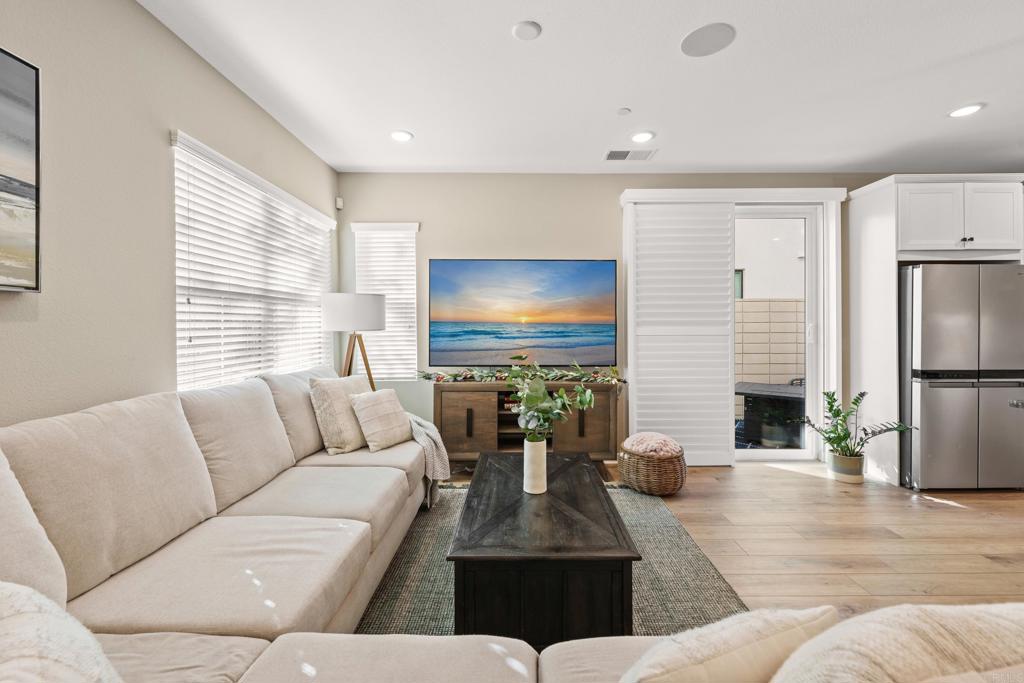 13085 Olympus Circle, Unit 1 Poway, CA 92064 - Photo 12 of 44 a living room with furniture and a flat screen tv