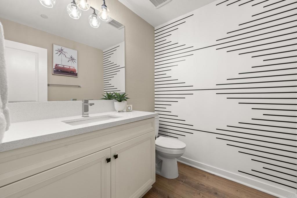 13085 Olympus Circle, Unit 1 Poway, CA 92064 - Photo 14 of 44 a bathroom with a sink a toilet and mirror