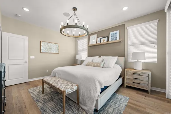 a bedroom with bed and a window