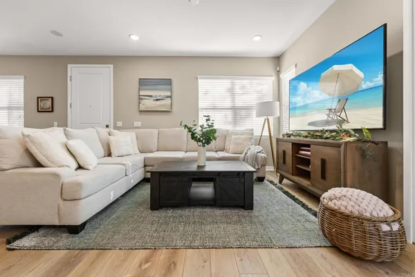 a living room with furniture rug and window