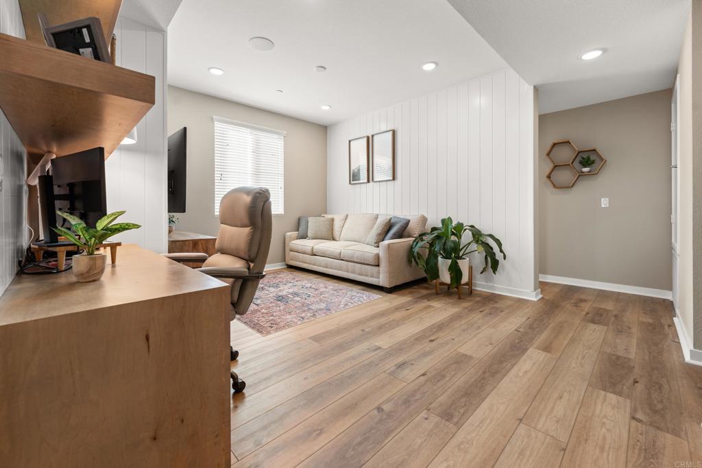 13085 Olympus Circle, Unit 1 Poway, CA 92064 - Photo 26 of 44 a living room with furniture and wooden floor