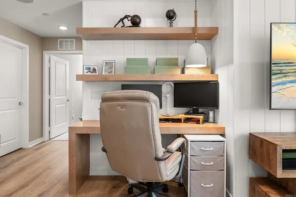 a room with furniture a flat screen tv and a window