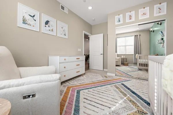 a bedroom with a bed and a couch