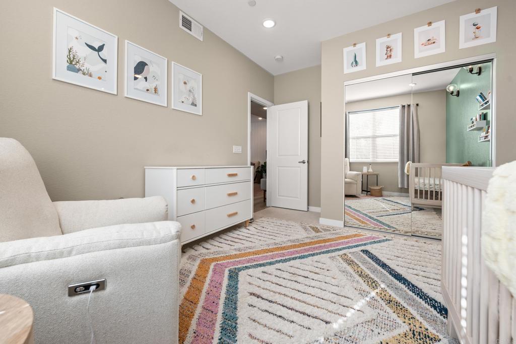 13085 Olympus Circle, Unit 1 Poway, CA 92064 - Photo 34 of 44 a bedroom with a bed and a couch