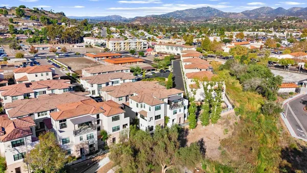 an aerial view of residential houses with outdoor space