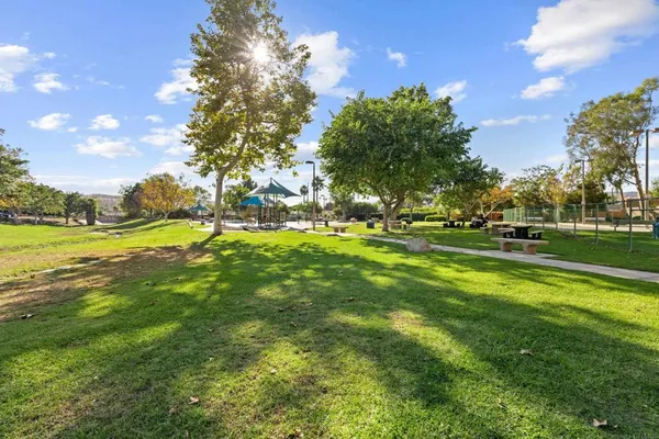 a view of outdoor space with garden and trees