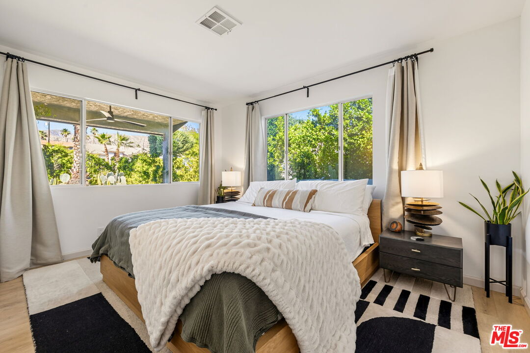 66869 San Ardo Road Desert Hot Springs, CA 92240 - Photo 28 of 39 a bedroom with a bed and a large window
