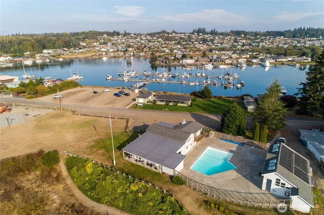 an aerial view of a house with a lake view