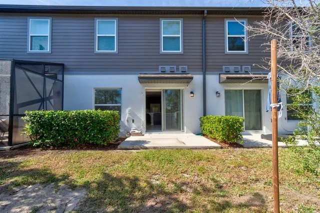 a view of a swimming pool and trees in the background