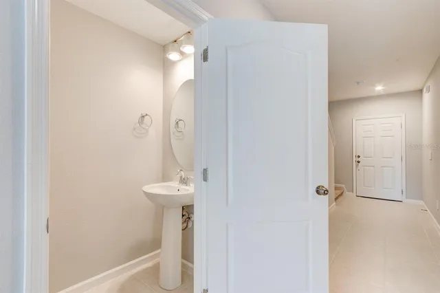 a bathroom with a sink and mirror
