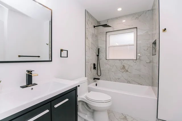 a view of a house with yard and tree s