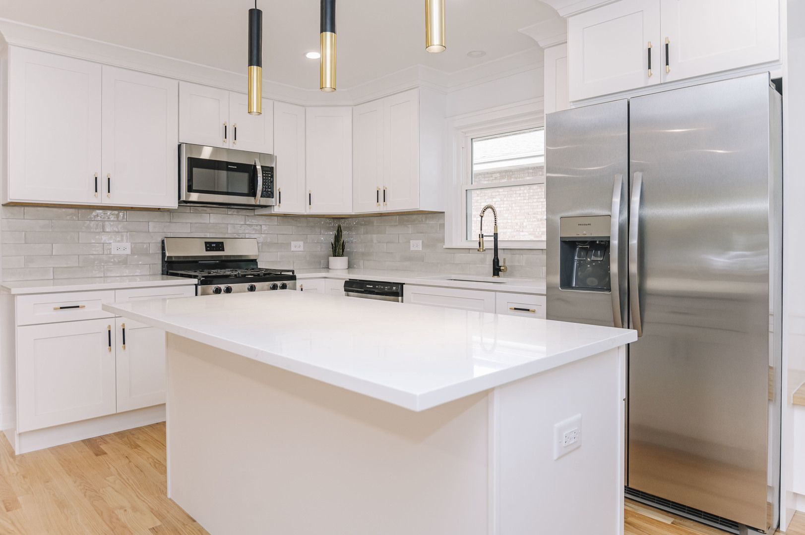 6800 97th Street Oak Lawn, IL 60453 - Photo 4 of 18 a kitchen with stainless steel appliances a refrigerator sink and white cabinets