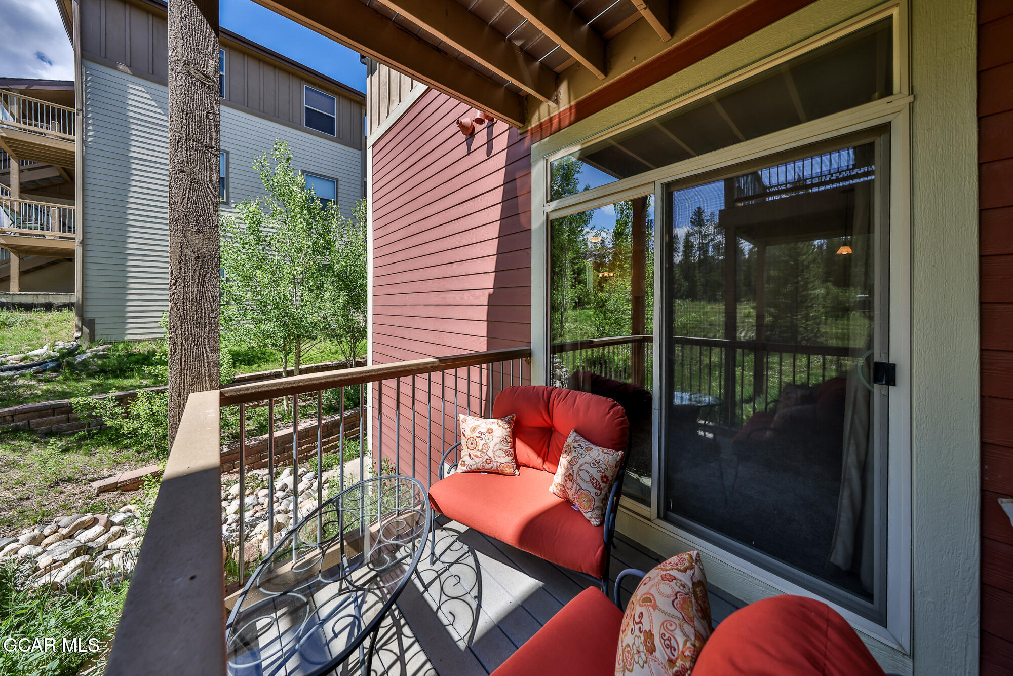 175 Gcr 8340, Unit 1 Fraser, CO 80442 - Photo 12 of 28 a view of a balcony with chair and table