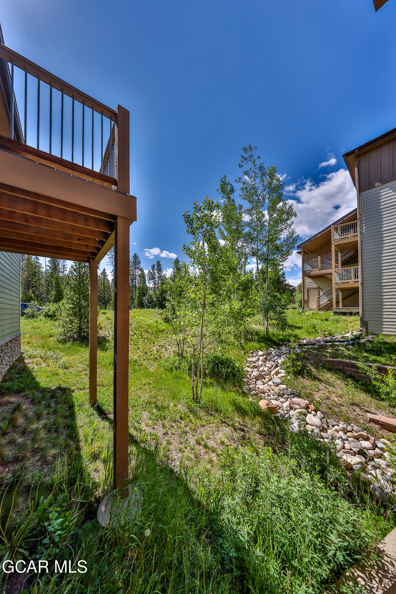 175 Gcr 8340, Unit 1 Fraser, CO 80442 - Photo 13 of 28 a view of a house with a yard
