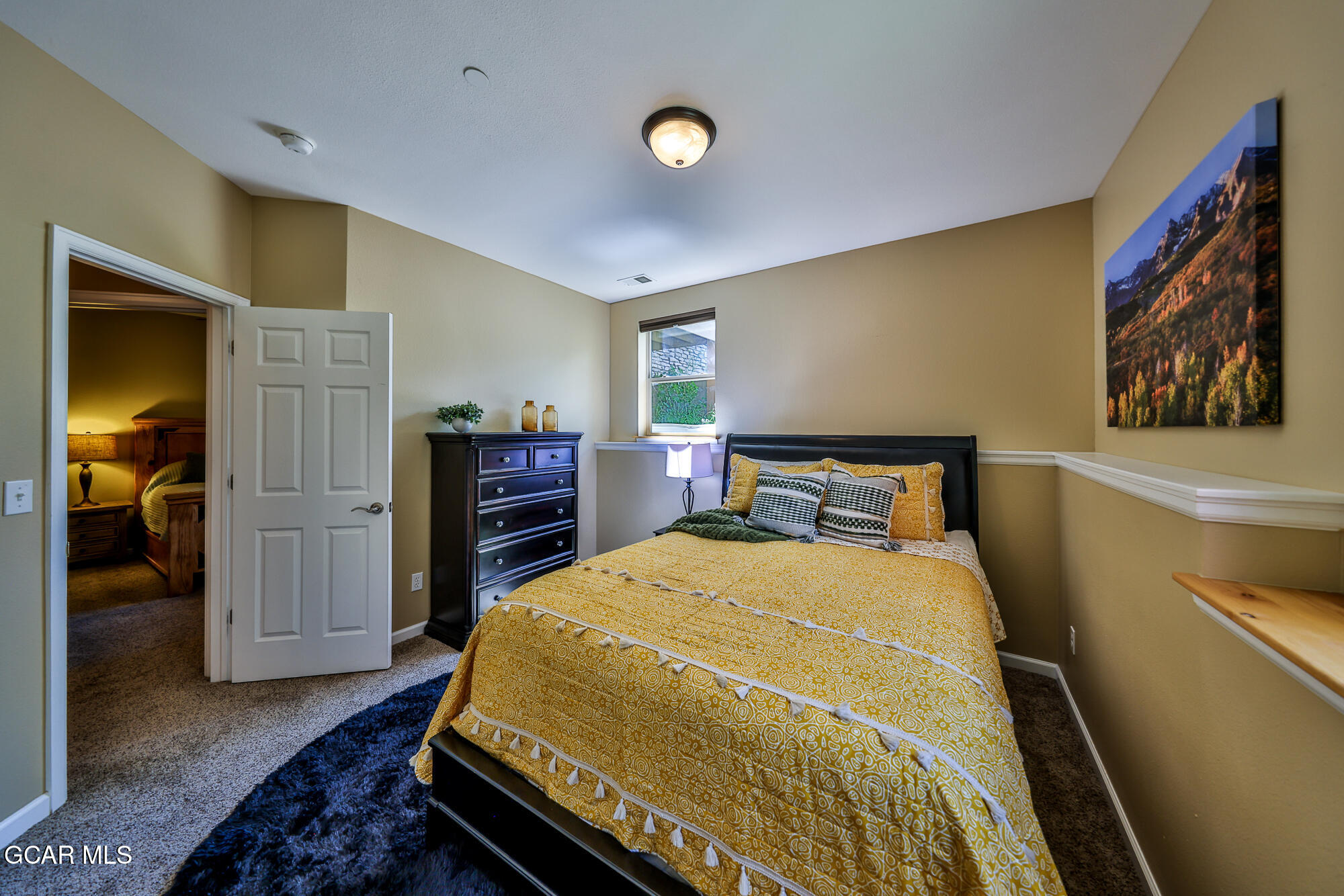 175 Gcr 8340, Unit 1 Fraser, CO 80442 - Photo 20 of 28 a bedroom with a bed and a walk in closet