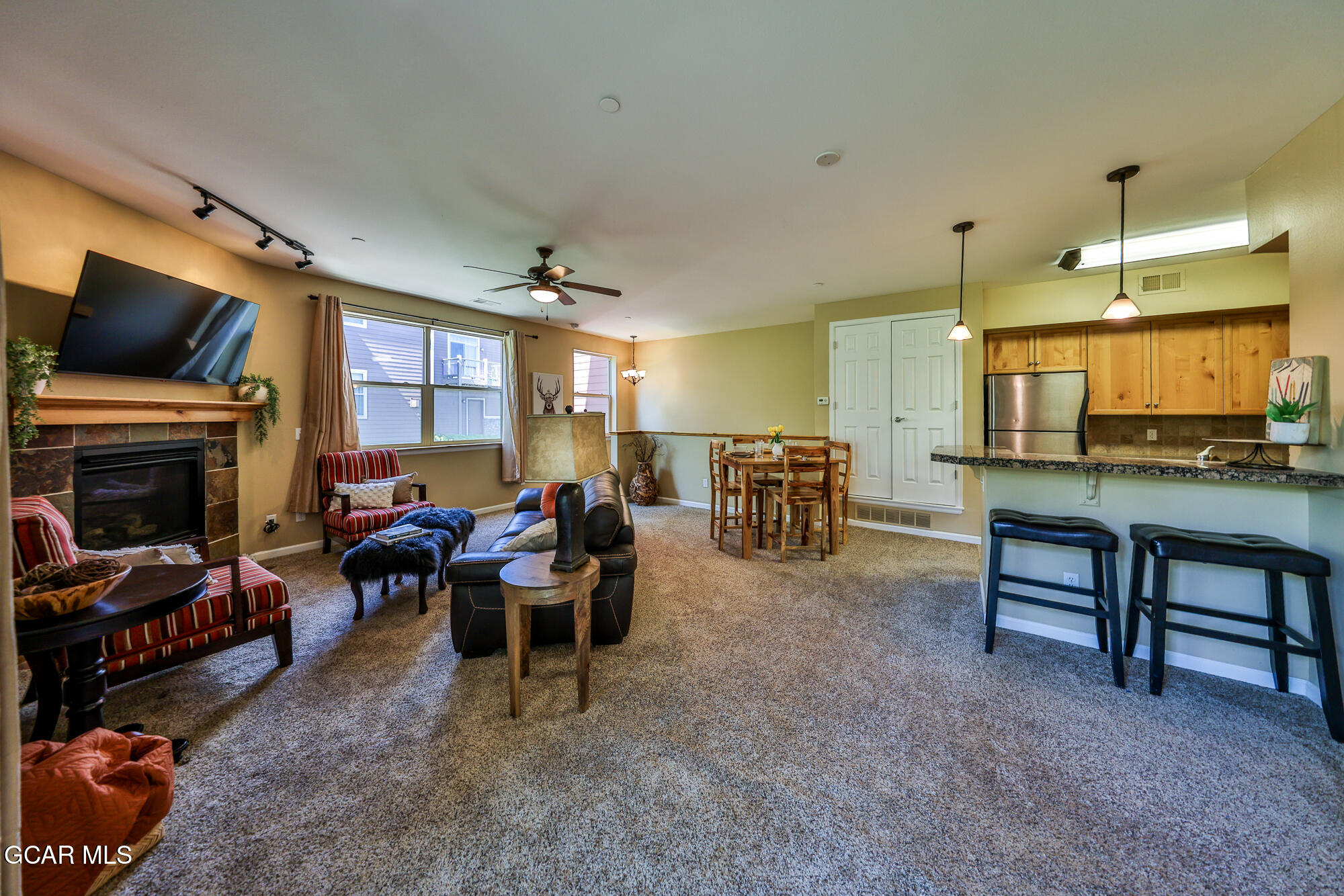 175 Gcr 8340, Unit 1 Fraser, CO 80442 - Photo 2 of 28 a living room with furniture and a flat screen tv