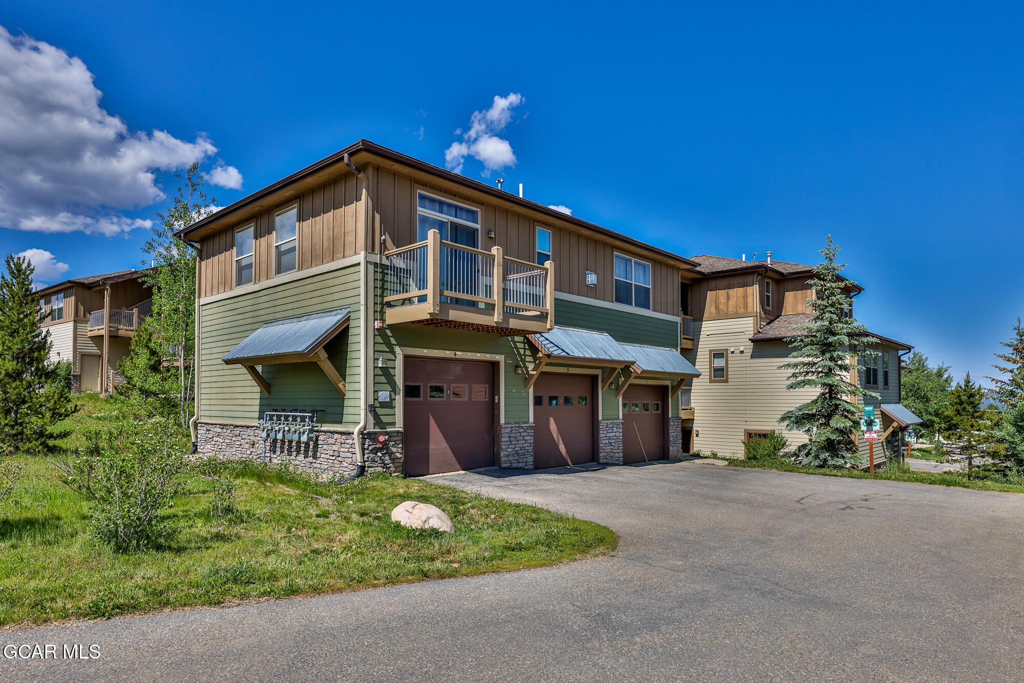 175 Gcr 8340, Unit 1 Fraser, CO 80442 - Photo 23 of 28 a front view of a house with a garden