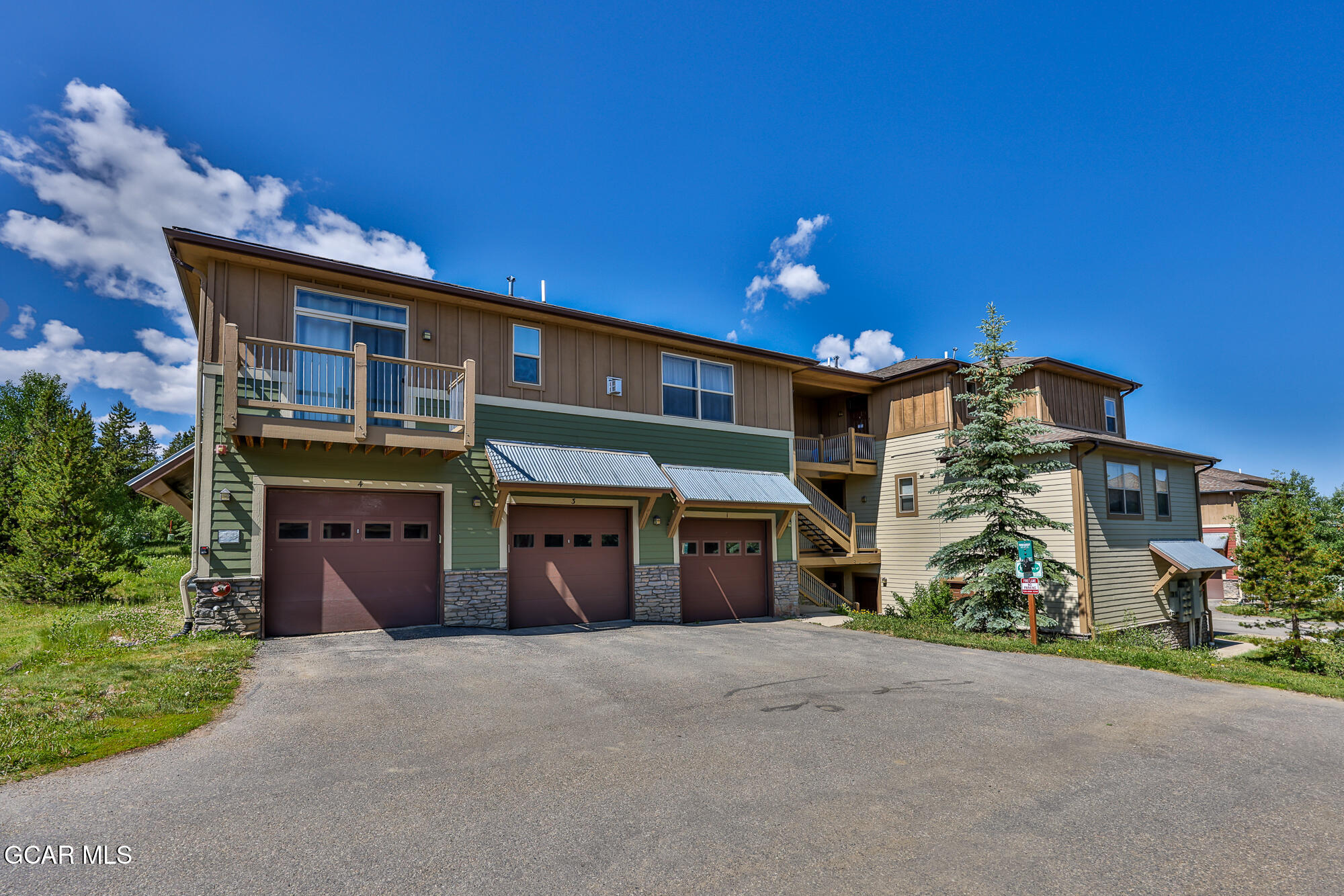 175 Gcr 8340, Unit 1 Fraser, CO 80442 - Photo 24 of 28 a front view of a house with a yard