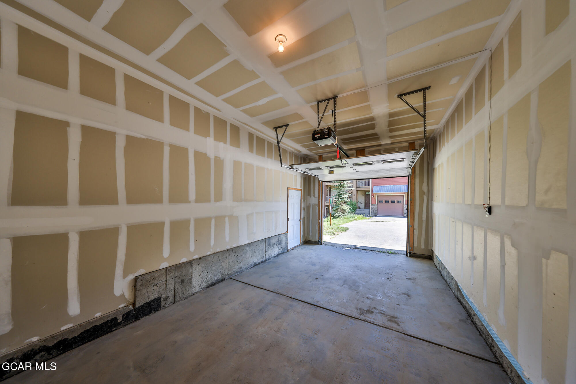 175 Gcr 8340, Unit 1 Fraser, CO 80442 - Photo 26 of 28 a view of an empty room with stairs