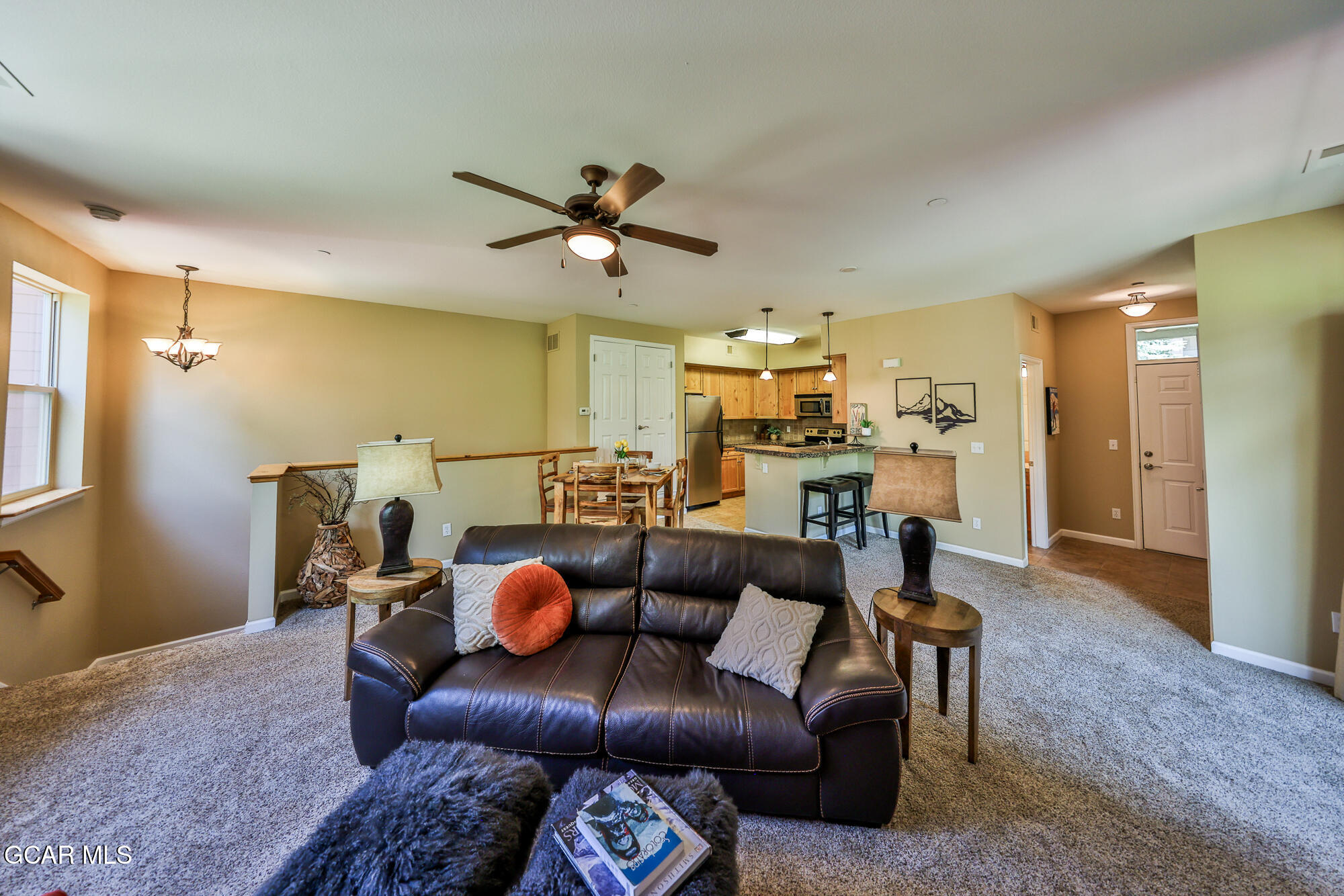 175 Gcr 8340, Unit 1 Fraser, CO 80442 - Photo 4 of 28 a living room with furniture and kitchen view