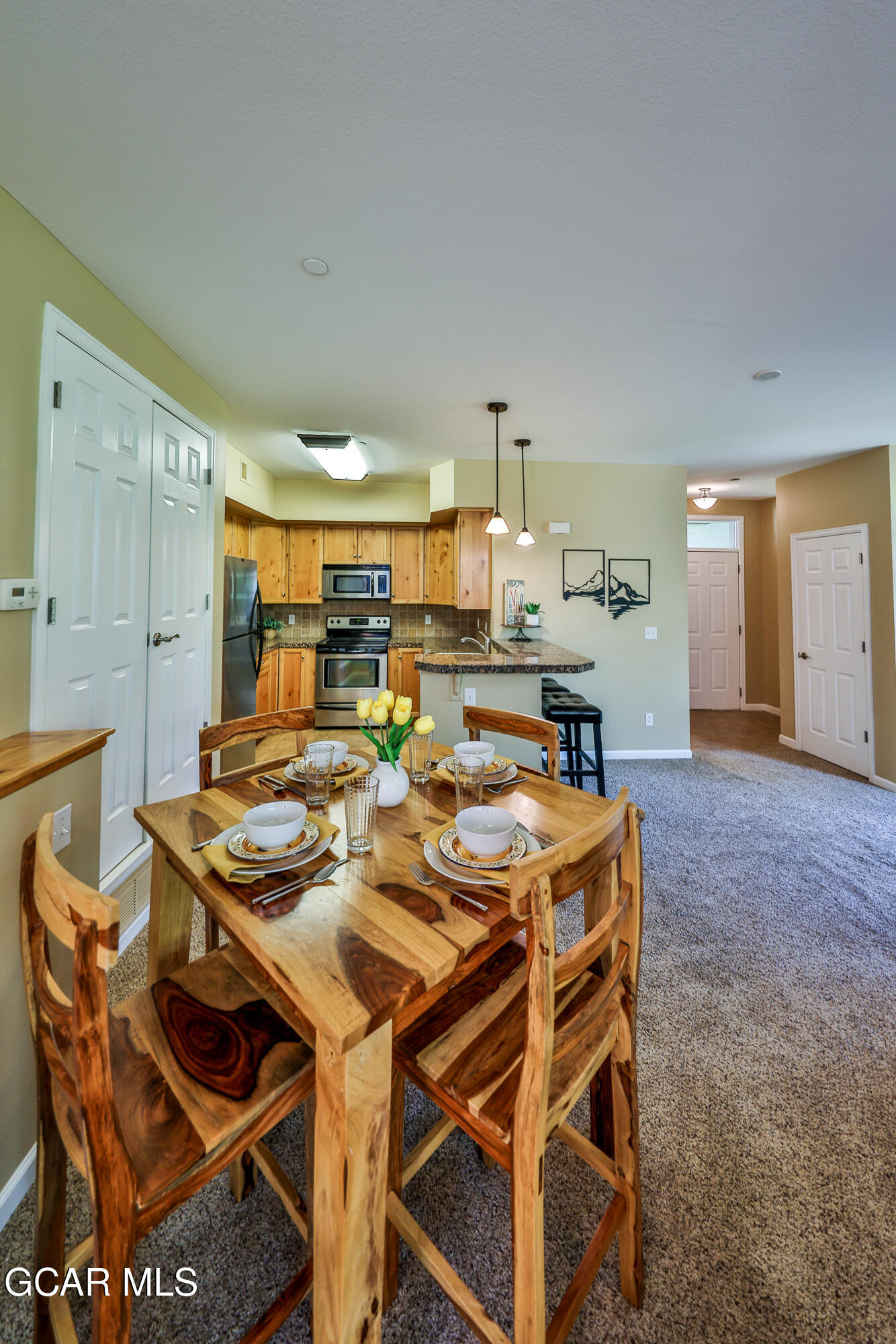 175 Gcr 8340, Unit 1 Fraser, CO 80442 - Photo 6 of 28 a dinning table and chairs in a open kitchen