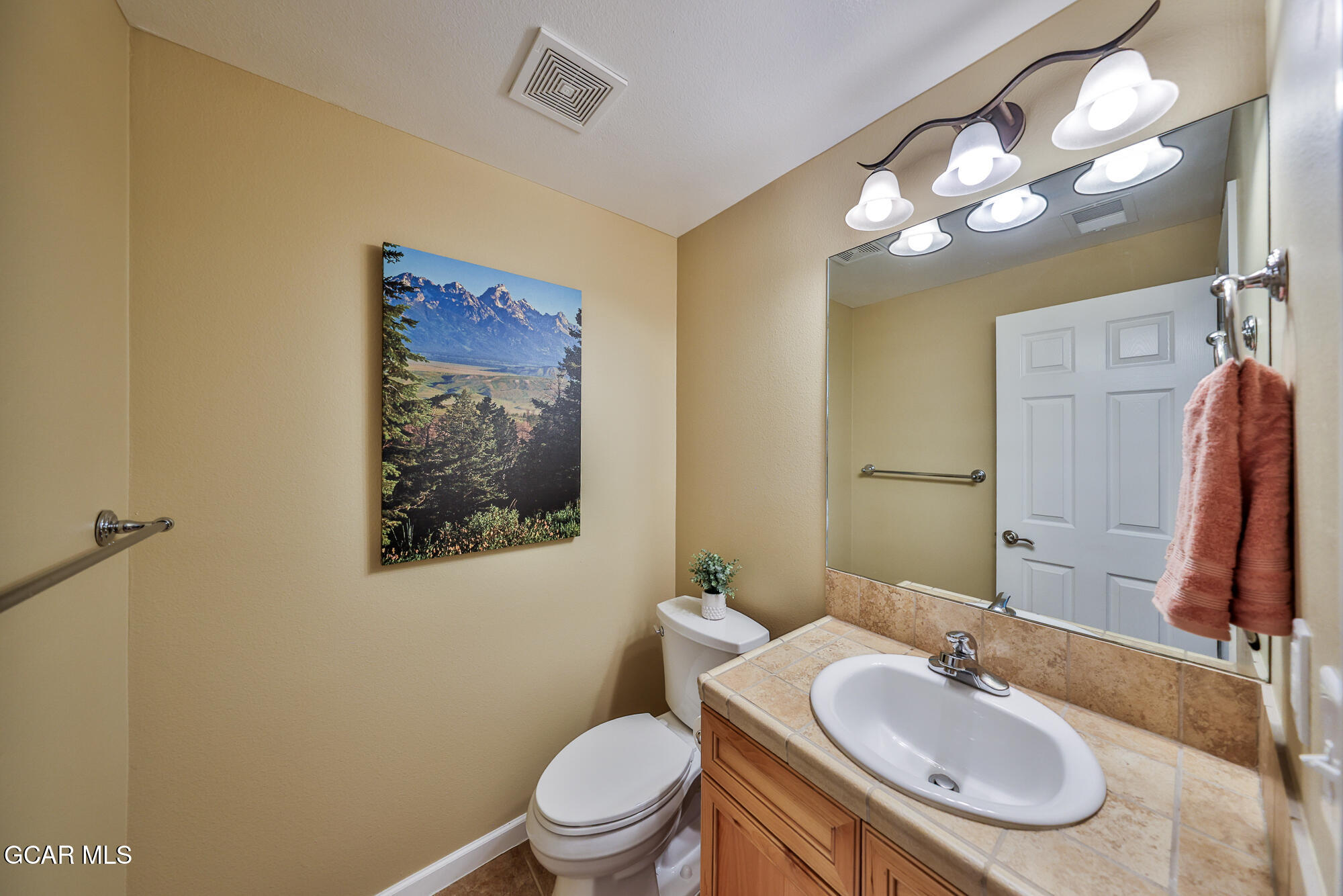175 Gcr 8340, Unit 1 Fraser, CO 80442 - Photo 10 of 28 a bathroom with a sink vanity mirror and toilet