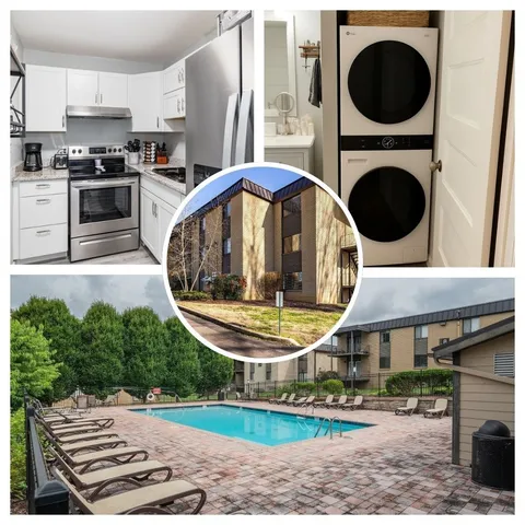 a view of a kitchen with stainless steel appliances granite countertop a stove a sink and a fireplace