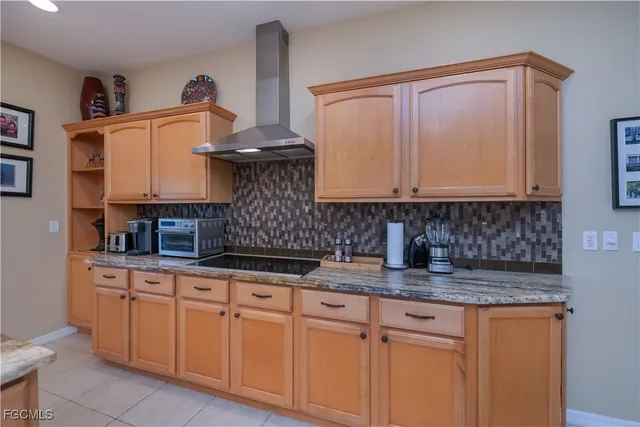 a large kitchen with a table and chairs in it