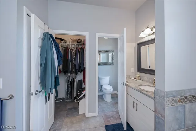 a bathroom with a mirror and a sink