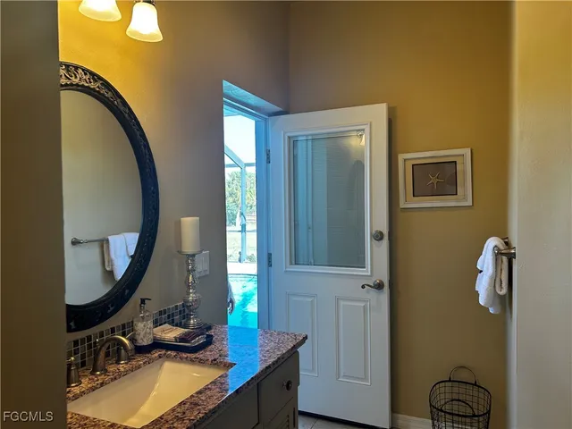 a bedroom with furniture and window