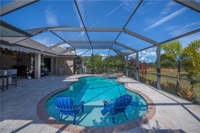 a view of a chair and tables in the patio