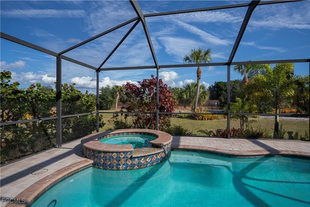 a view of a backyard with sitting area