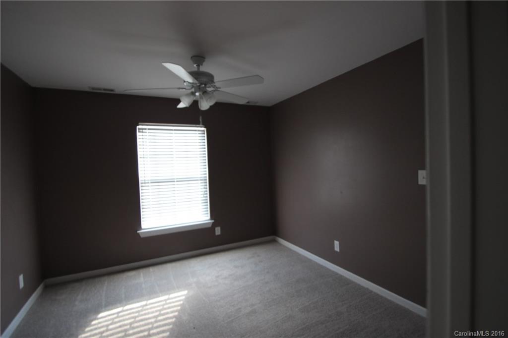 447 Maynard Grayson Road Clover, SC 29710 - Photo 16 of 19 an empty room with a window and a fan