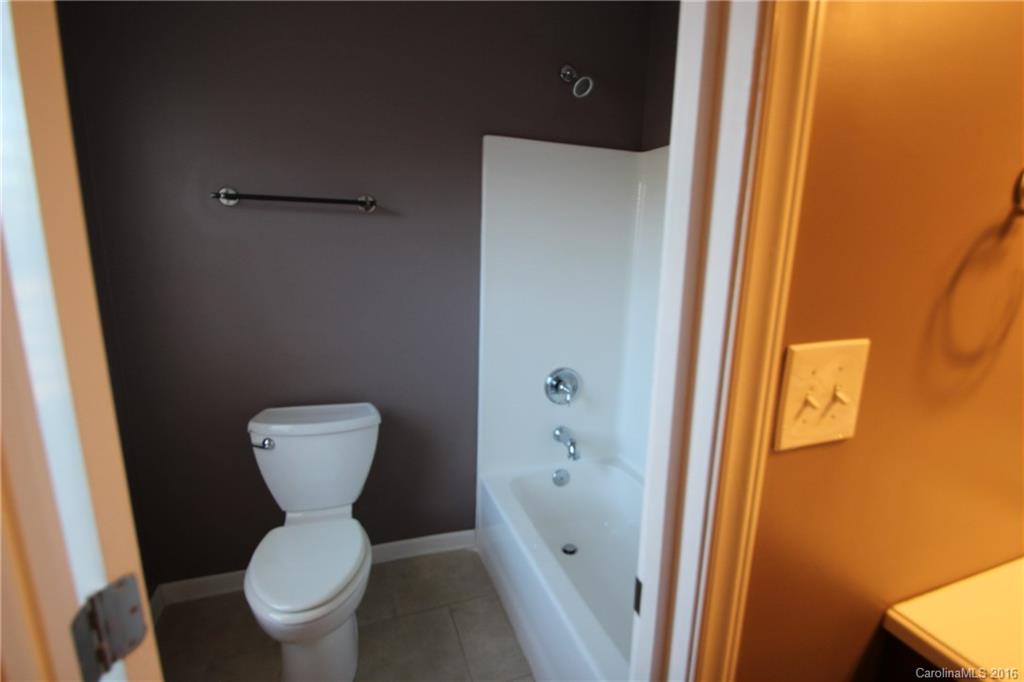 447 Maynard Grayson Road Clover, SC 29710 - Photo 18 of 19 a bathroom with a toilet and a shower
