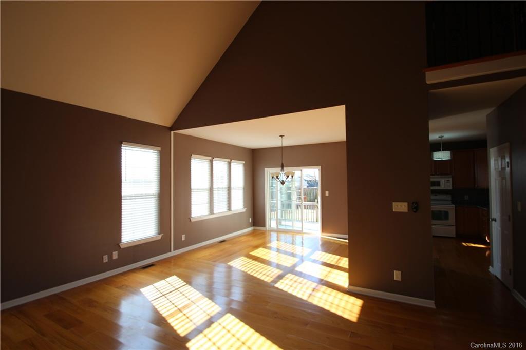447 Maynard Grayson Road Clover, SC 29710 - Photo 8 of 19 a view of an empty room with wooden floor and a window
