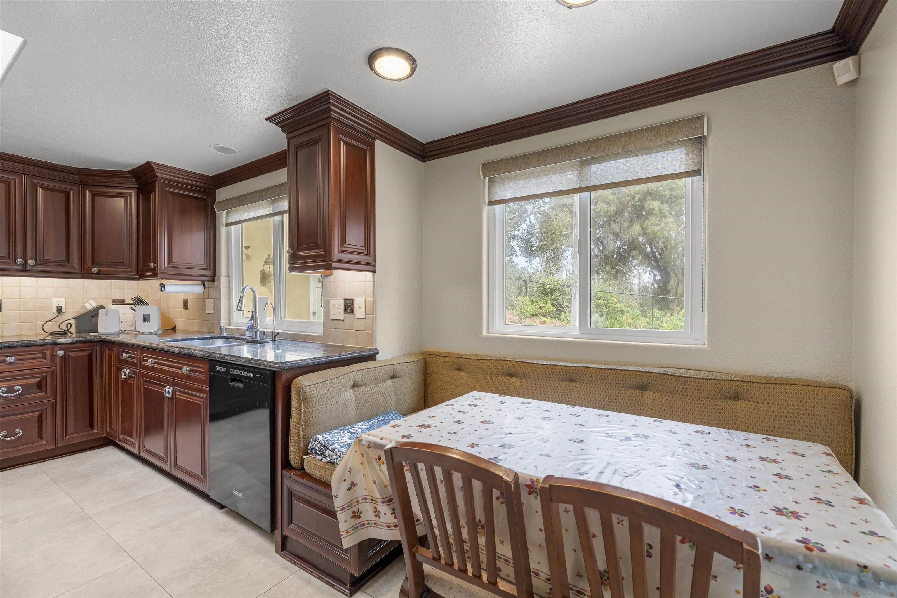 1315 Macadamia Drive Fallbrook, CA 92028 - Photo 13 of 59 a kitchen with a stove a sink and a window