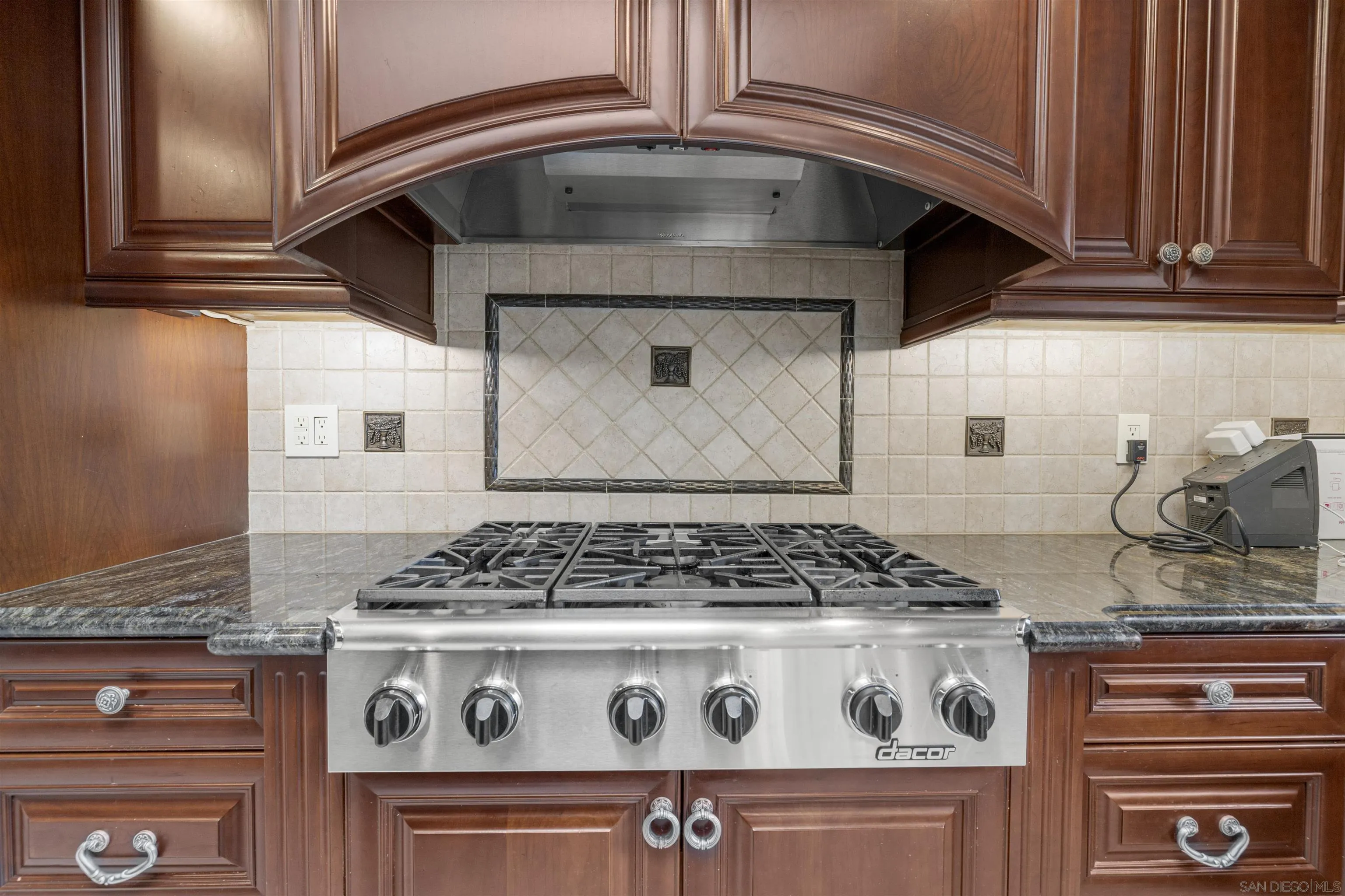 1315 Macadamia Drive Fallbrook, CA 92028 - Photo 16 of 59 a stove top oven sitting inside of a kitchen