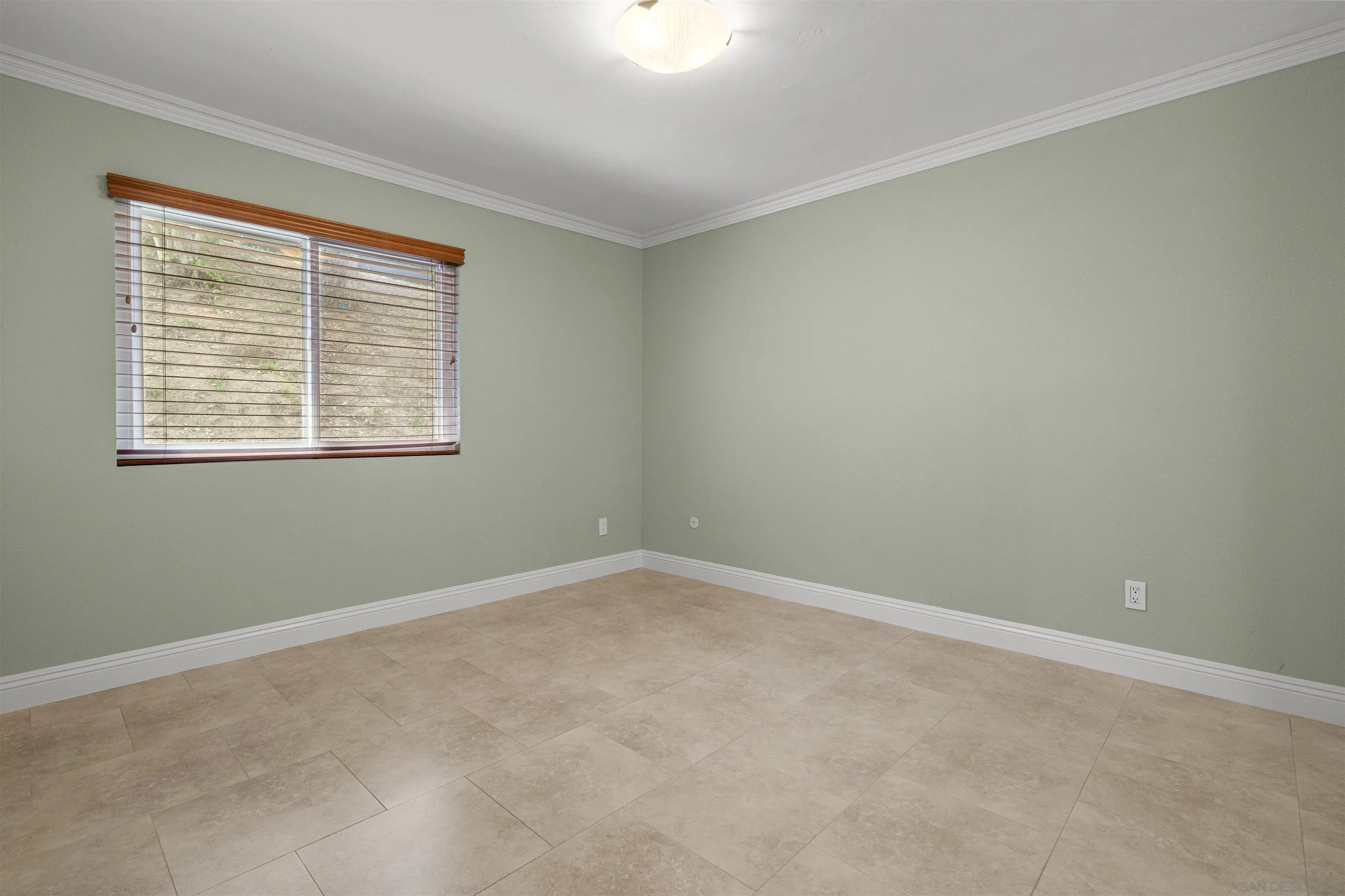 1315 Macadamia Drive Fallbrook, CA 92028 - Photo 21 of 59 an empty room with a window