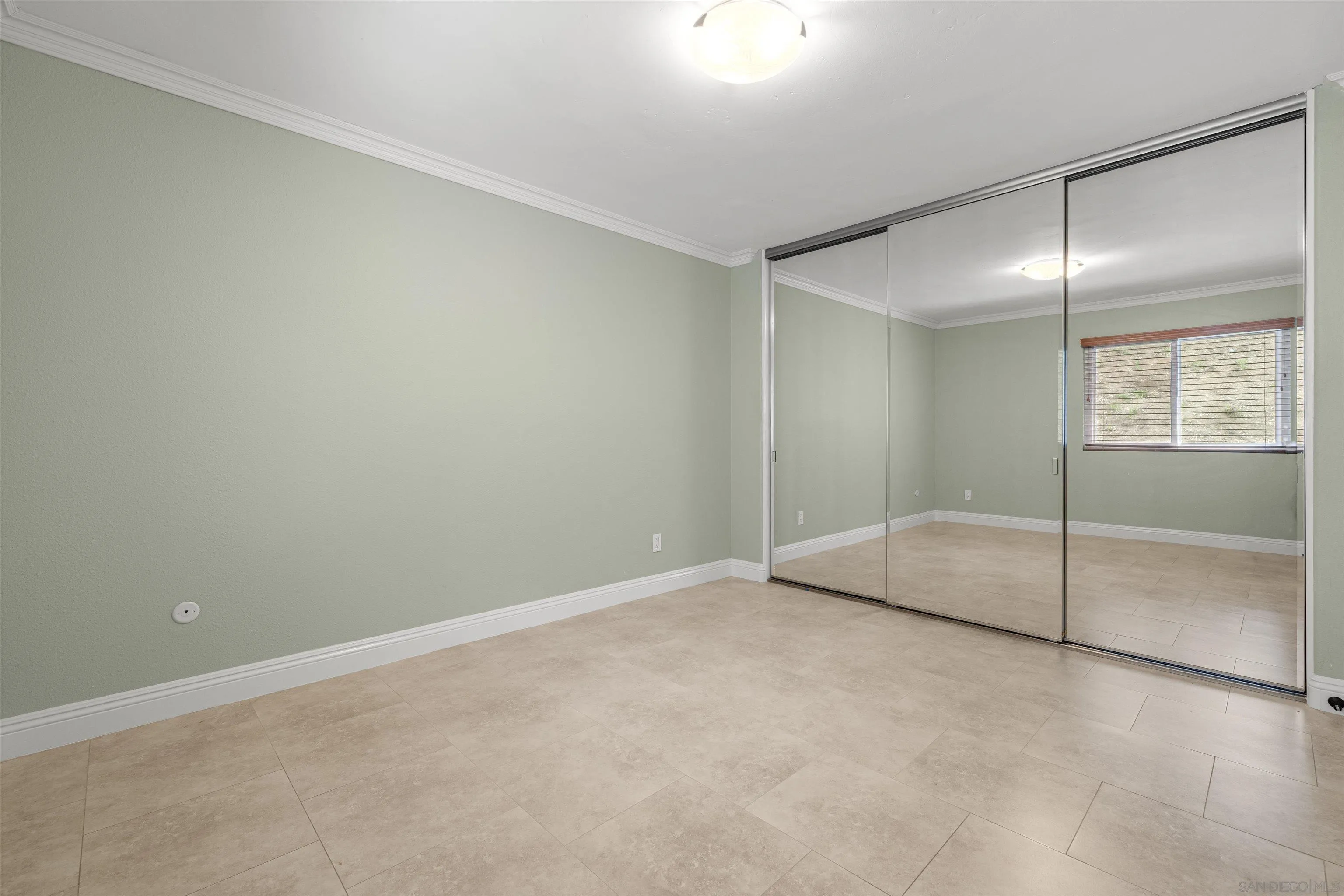 1315 Macadamia Drive Fallbrook, CA 92028 - Photo 22 of 59 an empty room with sliding glass door and shower