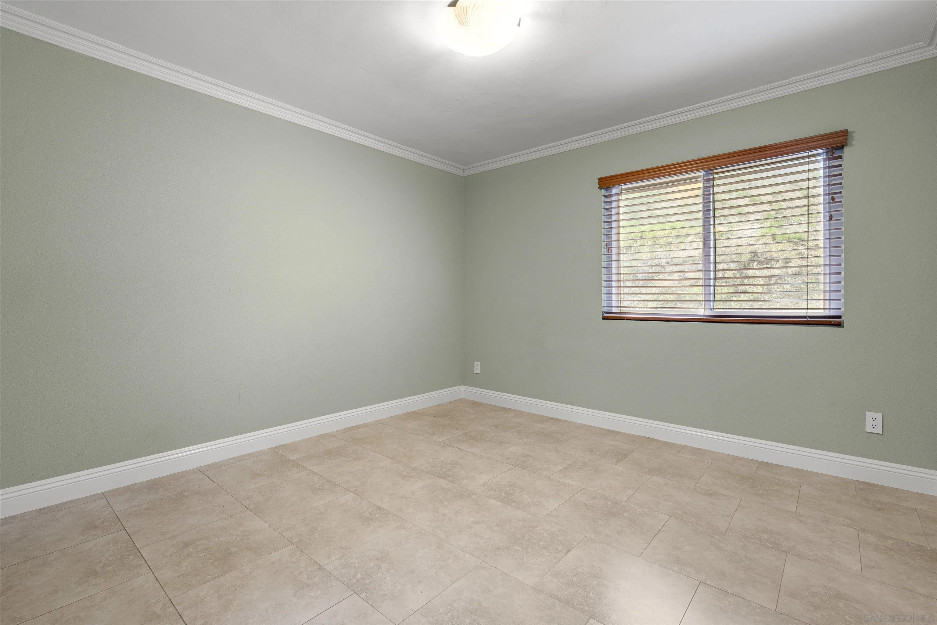 1315 Macadamia Drive Fallbrook, CA 92028 - Photo 24 of 59 an empty room with a window