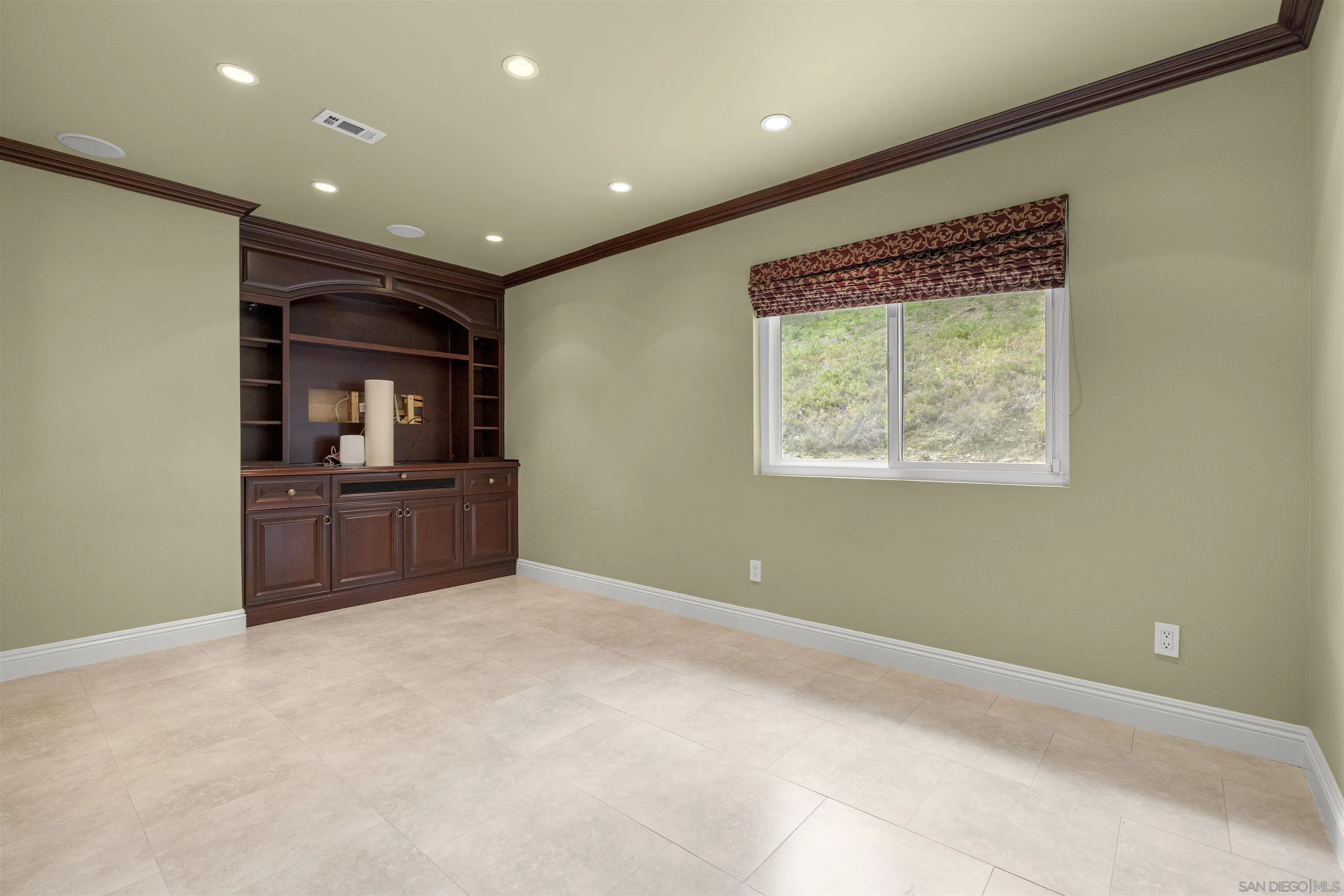 1315 Macadamia Drive Fallbrook, CA 92028 - Photo 26 of 59 a view of an empty room with a window