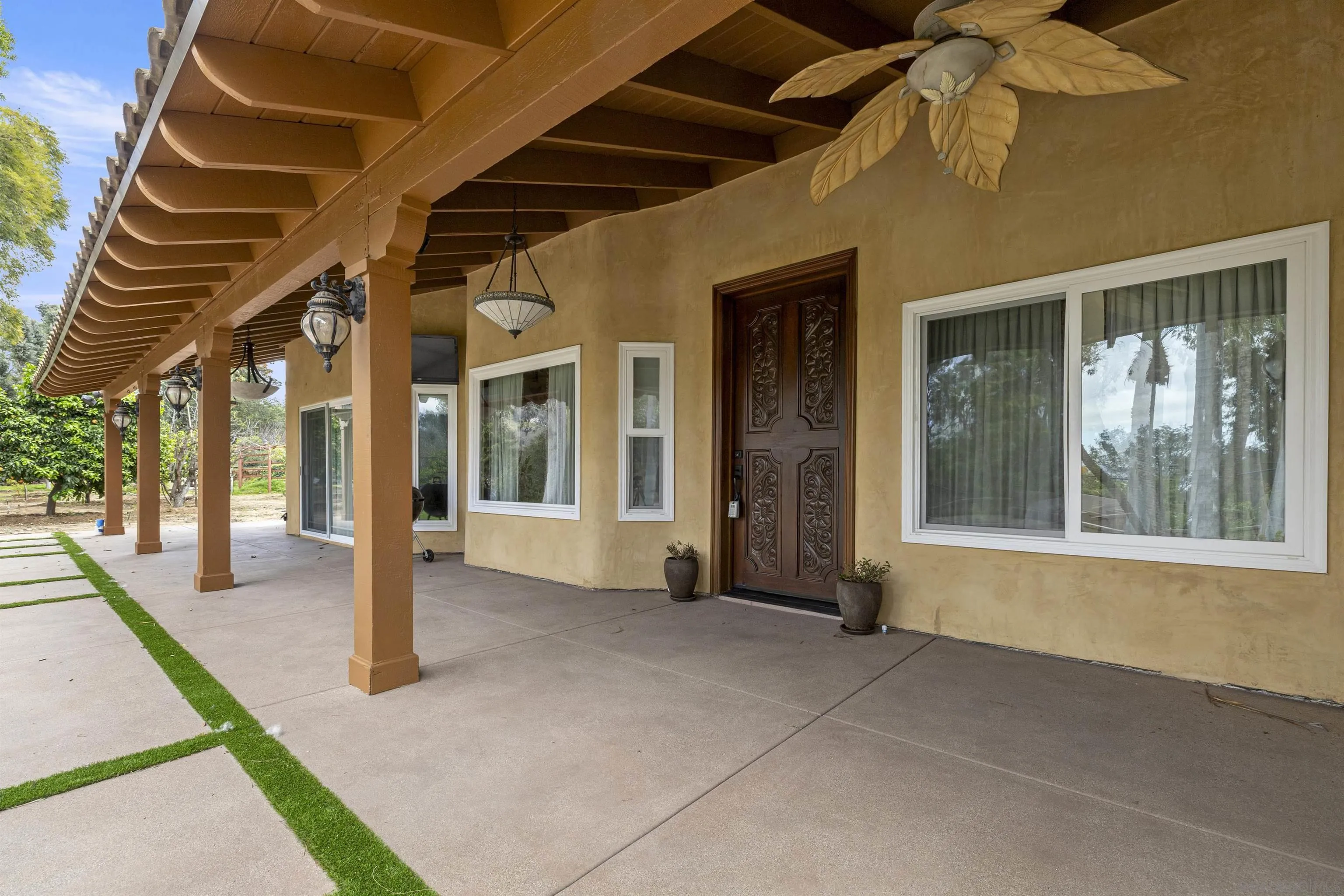 1315 Macadamia Drive Fallbrook, CA 92028 - Photo 40 of 59 a view of an entryway with a floor to ceiling window and an entrance